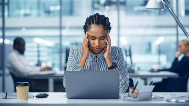 Woman suffering with Headaches