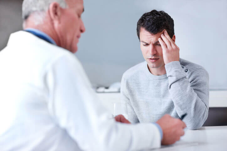 Man Suffering With Headache